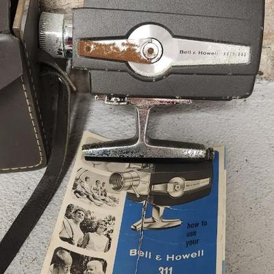 Sale Photo Thumbnail #723: Bell and Howell 311 in case...camera is in thought shape. Old tripod, Univex and exposure meter