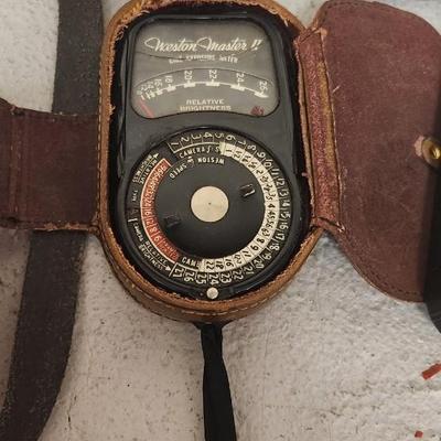 Sale Photo Thumbnail #720: Bell and Howell 311 in case...camera is in thought shape. Old tripod, Univex and exposure meter