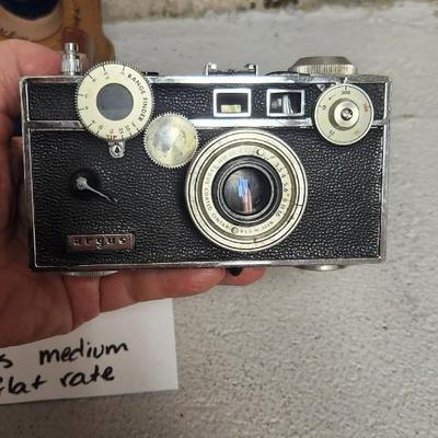 Sale Photo Thumbnail #729: Argus C3 camera with neat writing inside the case and L3 light meter. Fits medium flat rate box