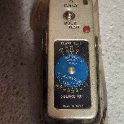 Sale Photo Thumbnail #748: Pair of sun guns, tripod (heavy) battery pack and exposure meter. Fits large flat rate box