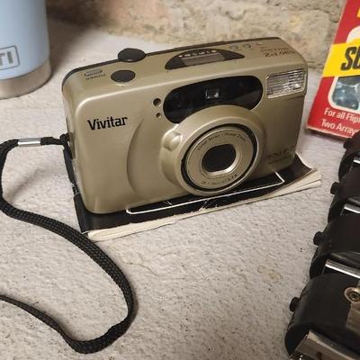 Sale Photo Thumbnail #768: Misc lot of flash bulbs, film and a couple vivitar cameras