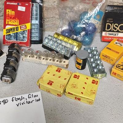 Sale Photo Thumbnail #765: Misc lot of flash bulbs, film and a couple vivitar cameras
