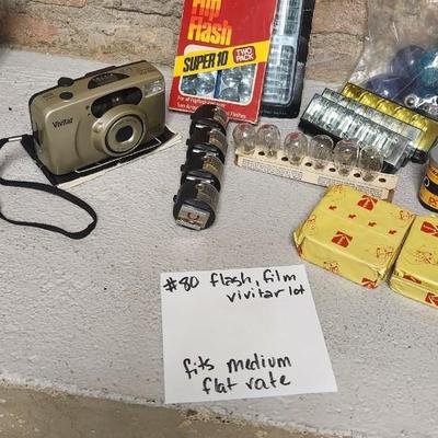 Sale Photo Thumbnail #764: Misc lot of flash bulbs, film and a couple vivitar cameras