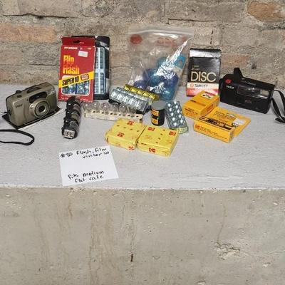 Sale Photo Thumbnail #763: Misc lot of flash bulbs, film and a couple vivitar cameras
