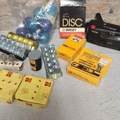 Sale Photo Thumbnail #766: Misc lot of flash bulbs, film and a couple vivitar cameras
