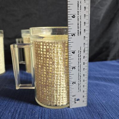 Wooden nut bowl with two wood candle holders a Interpur insulated carafe pitcher with four mugs