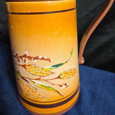 Wooden nut bowl with two wood candle holders a Interpur insulated carafe pitcher with four mugs