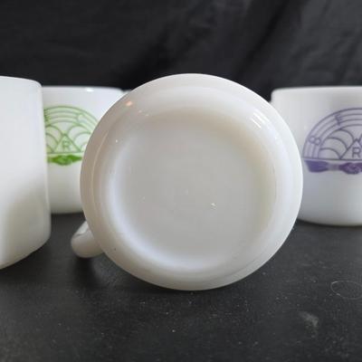 Set of Vintage milk glass mugs featuring the logo for the International Order of the Rainbow for Girls (IORG), with two mcdonalds mugs