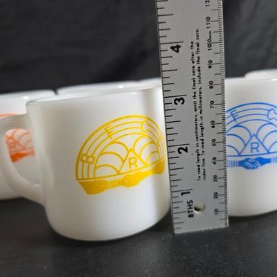 Set of Vintage milk glass mugs featuring the logo for the International Order of the Rainbow for Girls (IORG), with two mcdonalds mugs