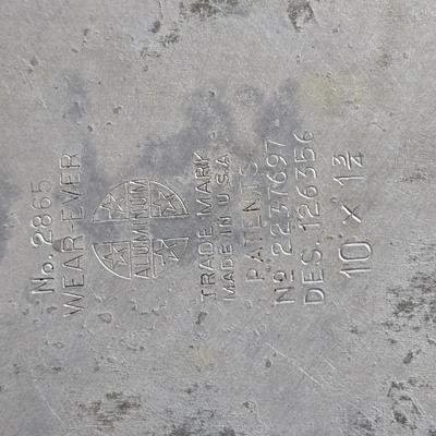 Stuart Bass three-blackbird pie funnel - Wilton 3-tier baking rack - a variety of pie pans and a cookbook