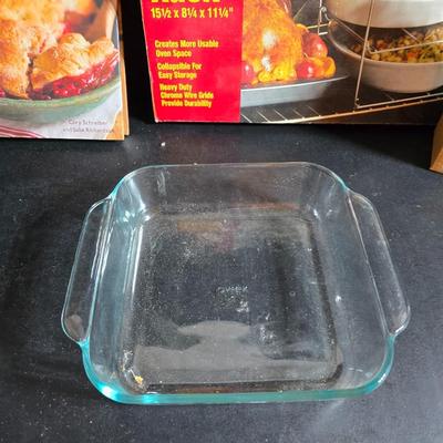 Stuart Bass three-blackbird pie funnel - Wilton 3-tier baking rack - a variety of pie pans and a cookbook