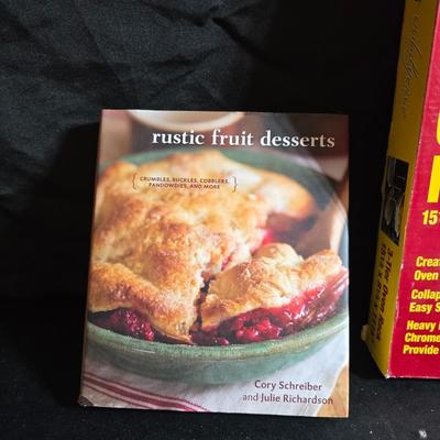 Stuart Bass three-blackbird pie funnel - Wilton 3-tier baking rack - a variety of pie pans and a cookbook