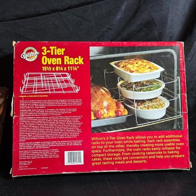 Stuart Bass three-blackbird pie funnel - Wilton 3-tier baking rack - a variety of pie pans and a cookbook
