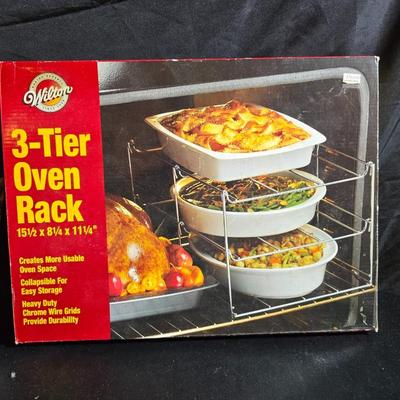 Stuart Bass three-blackbird pie funnel - Wilton 3-tier baking rack - a variety of pie pans and a cookbook
