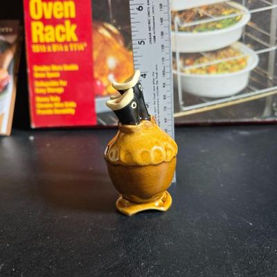 Stuart Bass three-blackbird pie funnel - Wilton 3-tier baking rack - a variety of pie pans and a cookbook