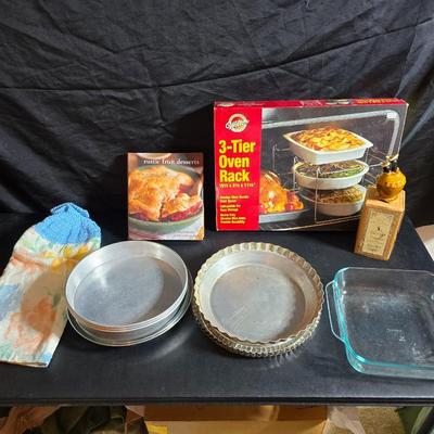 Stuart Bass three-blackbird pie funnel - Wilton 3-tier baking rack - a variety of pie pans and a cookbook