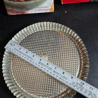 Stuart Bass three-blackbird pie funnel - Wilton 3-tier baking rack - a variety of pie pans and a cookbook