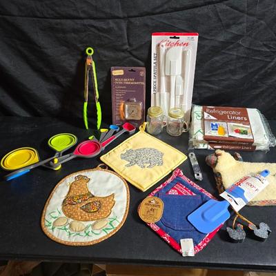 Kitchen accessories - Measure cups = Measuring spoons - Hot pads - Spatulas - Pitcher - Refrigerator liners and more