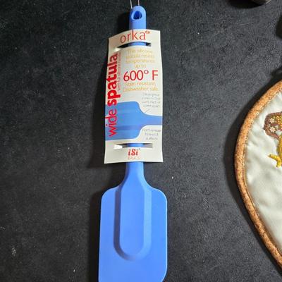 Kitchen accessories - Measure cups = Measuring spoons - Hot pads - Spatulas - Pitcher - Refrigerator liners and more