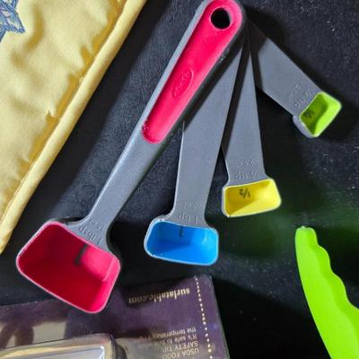 Kitchen accessories - Measure cups = Measuring spoons - Hot pads - Spatulas - Pitcher - Refrigerator liners and more