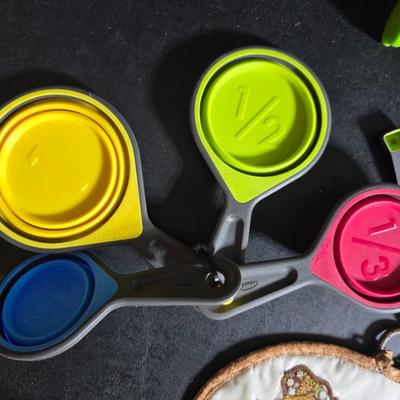 Kitchen accessories - Measure cups = Measuring spoons - Hot pads - Spatulas - Pitcher - Refrigerator liners and more
