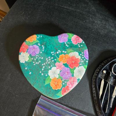 Dress shaped hanging organizer - Mirror - Nail care kit - Mini shaver - small trinket boxes - soap dispenser - and other hygiene makeup...