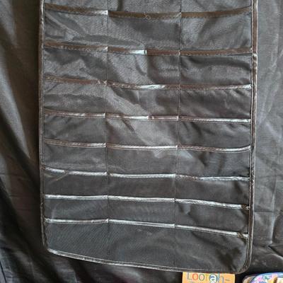 Dress shaped hanging organizer - Mirror - Nail care kit - Mini shaver - small trinket boxes - soap dispenser - and other hygiene makeup...