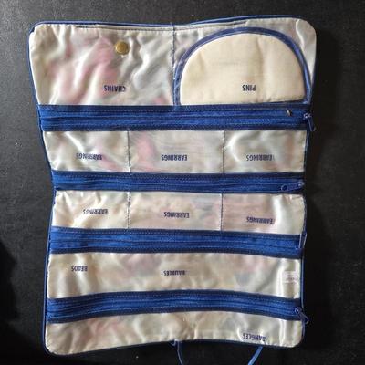 Dress shaped hanging organizer - Mirror - Nail care kit - Mini shaver - small trinket boxes - soap dispenser - and other hygiene makeup...