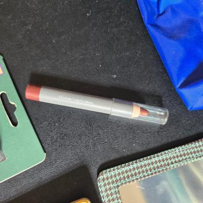 Dress shaped hanging organizer - Mirror - Nail care kit - Mini shaver - small trinket boxes - soap dispenser - and other hygiene makeup...