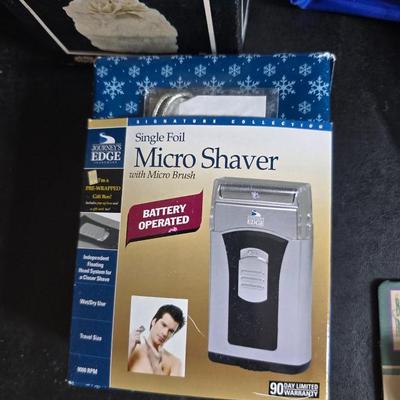 Dress shaped hanging organizer - Mirror - Nail care kit - Mini shaver - small trinket boxes - soap dispenser - and other hygiene makeup...