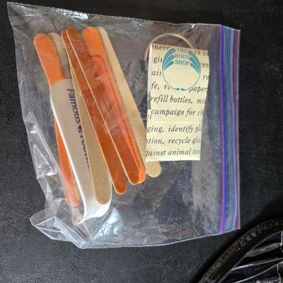 Dress shaped hanging organizer - Mirror - Nail care kit - Mini shaver - small trinket boxes - soap dispenser - and other hygiene makeup...