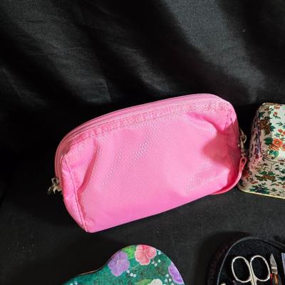 Dress shaped hanging organizer - Mirror - Nail care kit - Mini shaver - small trinket boxes - soap dispenser - and other hygiene makeup...