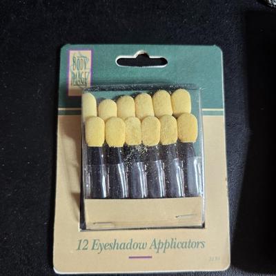 Dress shaped hanging organizer - Mirror - Nail care kit - Mini shaver - small trinket boxes - soap dispenser - and other hygiene makeup...