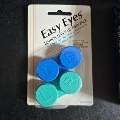 Dress shaped hanging organizer - Mirror - Nail care kit - Mini shaver - small trinket boxes - soap dispenser - and other hygiene makeup...