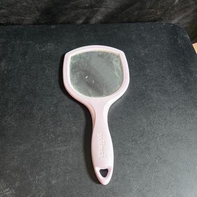 Dress shaped hanging organizer - Mirror - Nail care kit - Mini shaver - small trinket boxes - soap dispenser - and other hygiene makeup...