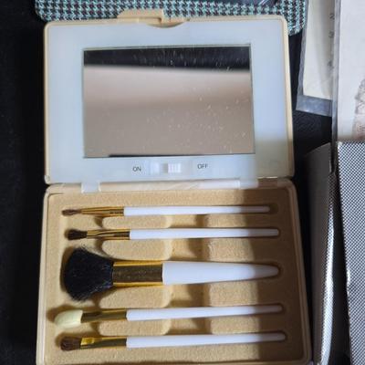 Dress shaped hanging organizer - Mirror - Nail care kit - Mini shaver - small trinket boxes - soap dispenser - and other hygiene makeup...