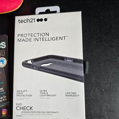 "Smart Bracelet" (fitness tracker) and a "nuckees" phone grip by Tzumi and protective glass for a Galaxy phone