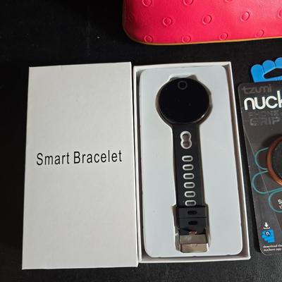 "Smart Bracelet" (fitness tracker) and a "nuckees" phone grip by Tzumi and protective glass for a Galaxy phone