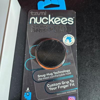 "Smart Bracelet" (fitness tracker) and a "nuckees" phone grip by Tzumi and protective glass for a Galaxy phone