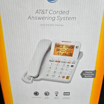 Brand new AT&T Corded answering system - atomic clock - with Notepads - World paper weight - and phone & addresses book