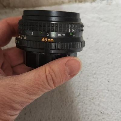 Sale Photo Thumbnail #859: Minolta Rokkor x 45 mm lens - orange writing