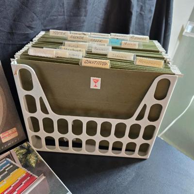 File box with new packages of folders and a nice wall clock