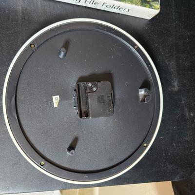 File box with new packages of folders and a nice wall clock