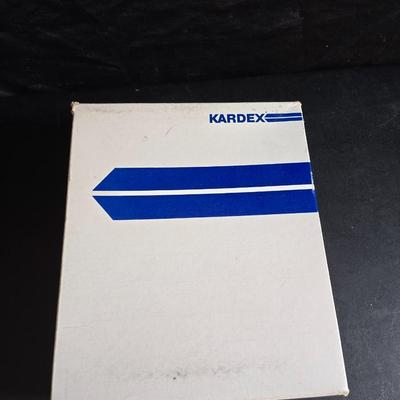 File box with new packages of folders and a nice wall clock