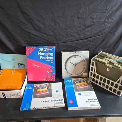 File box with new packages of folders and a nice wall clock