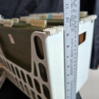 File box with new packages of folders and a nice wall clock