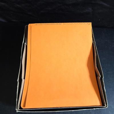 File box with new packages of folders and a nice wall clock