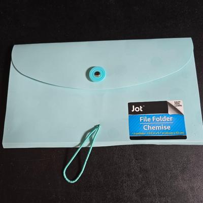 File box with new packages of folders and a nice wall clock