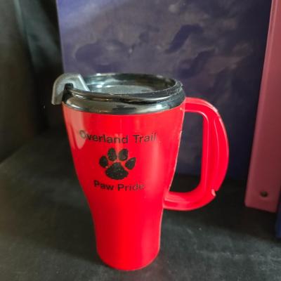 Home office or school supplies - binders - wall clock - clipboard - and an assortment of other office / school supplies.