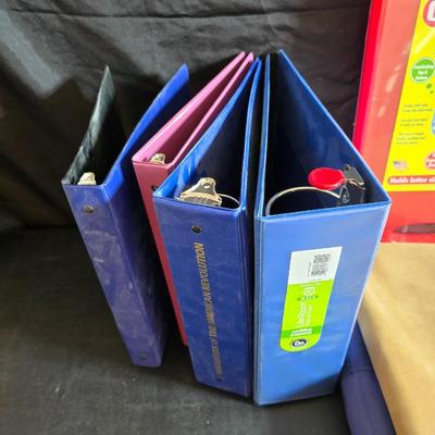 Home office or school supplies - binders - wall clock - clipboard - and an assortment of other office / school supplies.